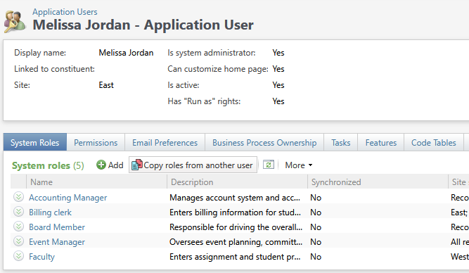 An application user record in Blackbaud CRM, with the “Copy roles from another user” button on the System Roles tab.